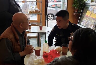 Image of Police Sergeant speaking with community member