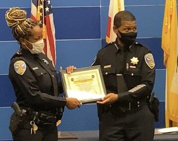 Officer Brittany Lewis as the FOB Officer of the Month and first recipient of the Community Policing Officer of the Month Award