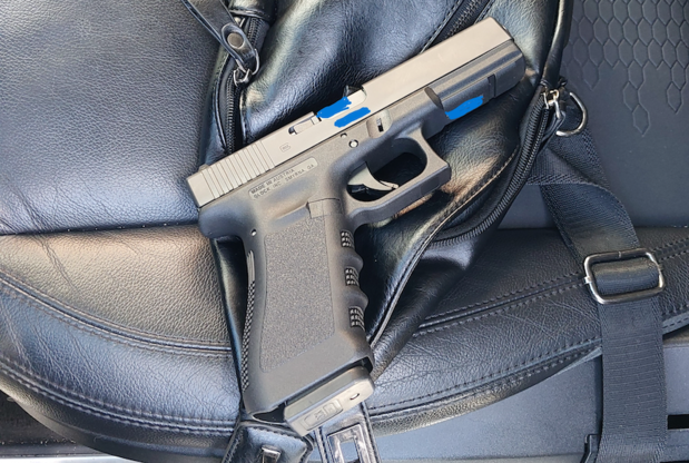 Image of firearm seized by lewd acts suspect arrested by officers