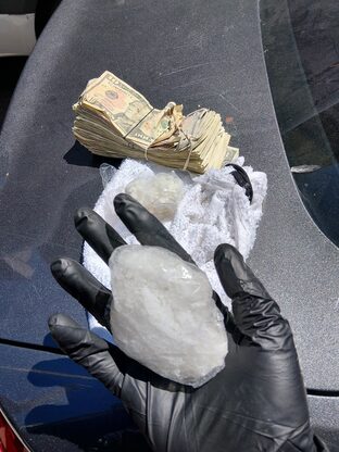 Image of narcotics and US currency seized in law enforcement operation