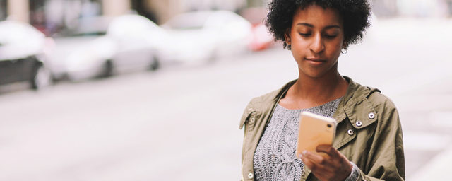 slide African American woman on cell phone