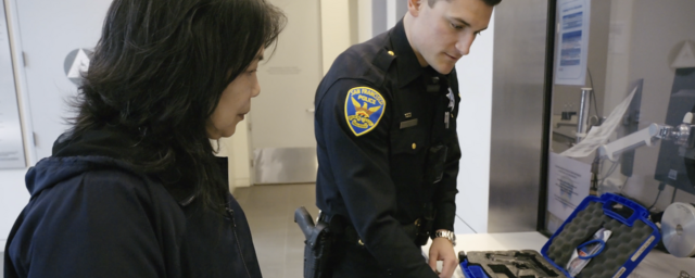 SFPD Officer Assisting Community Member in Safe Storage Program
